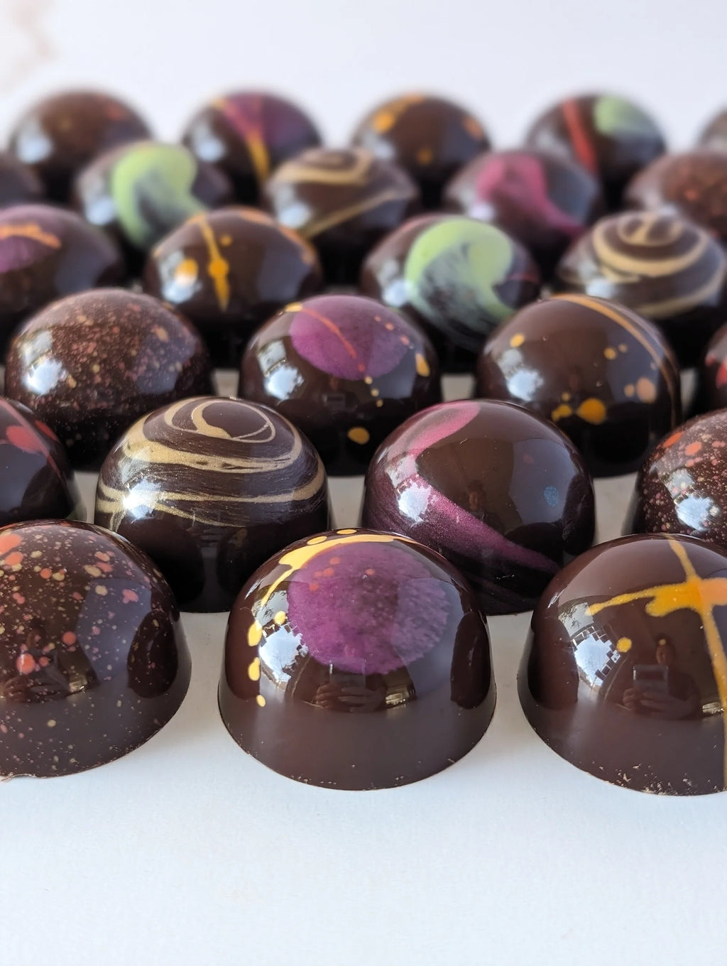 Homemade painted chocolate pralines
