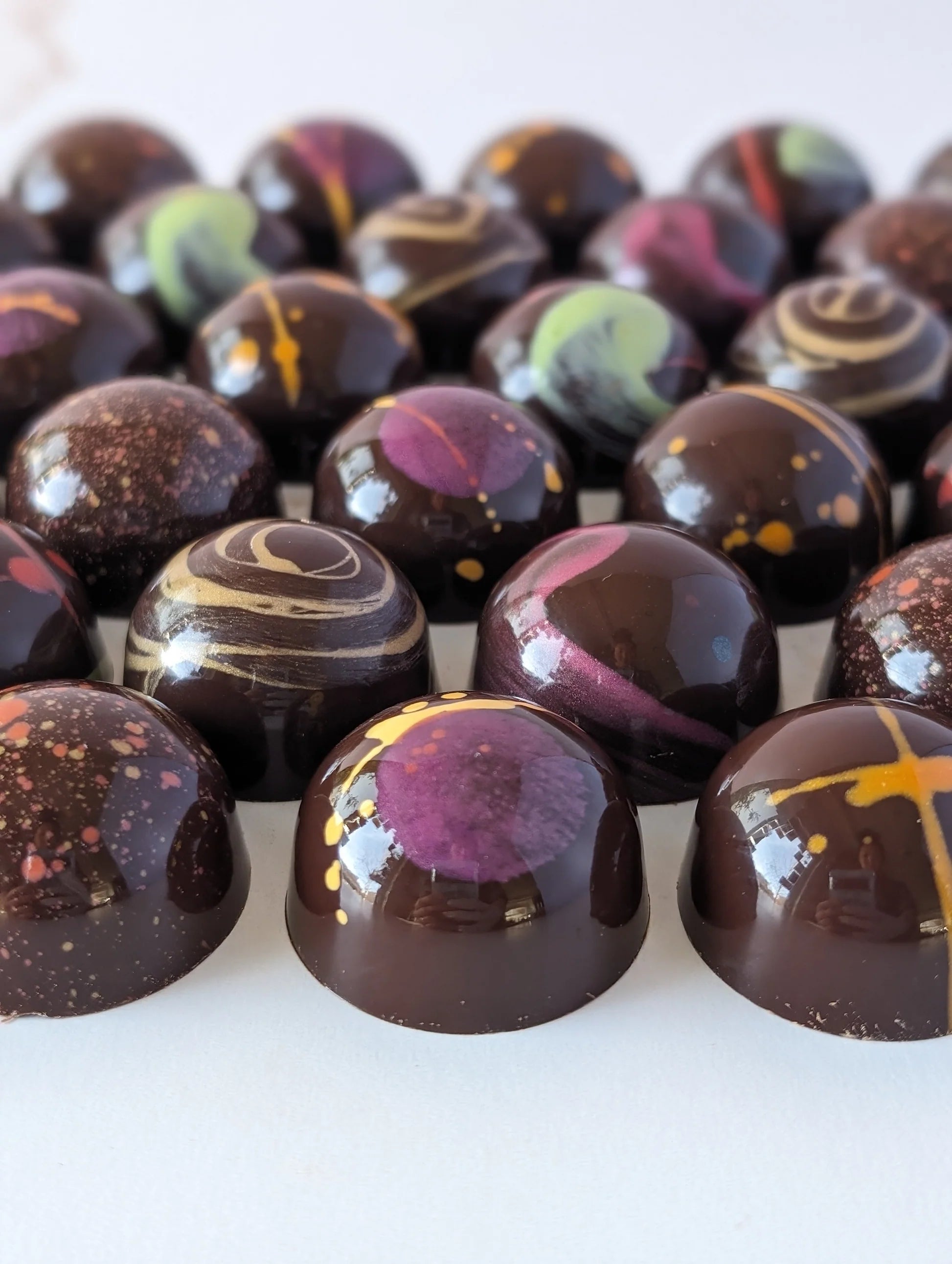 Homemade painted chocolate pralines